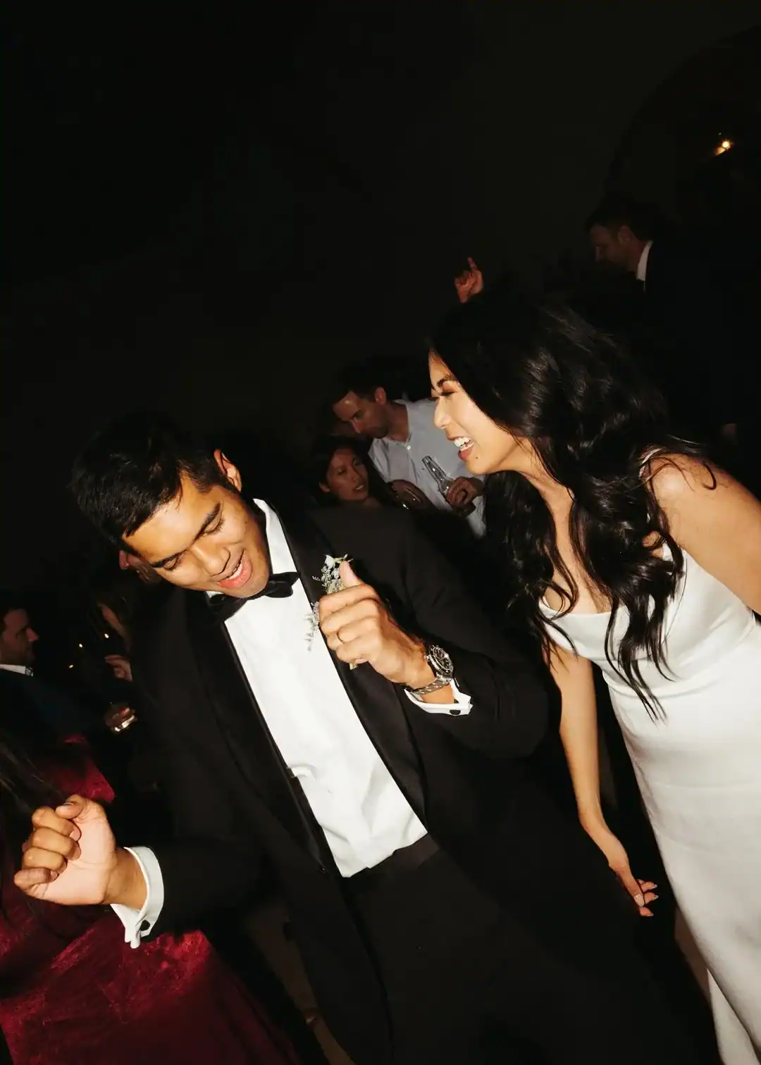 Christina and Steven dancing with guests after dark at Grand Gimeno, Orange
