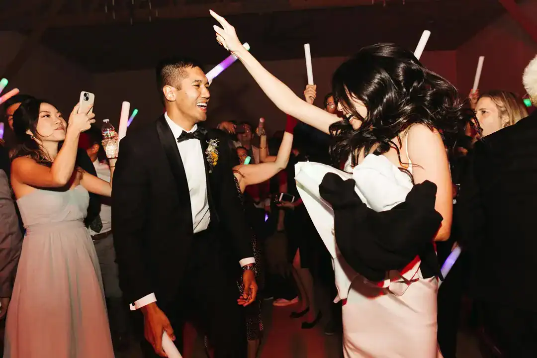 Christina and Steven dancing with guests at Grand Gimeno, Orange