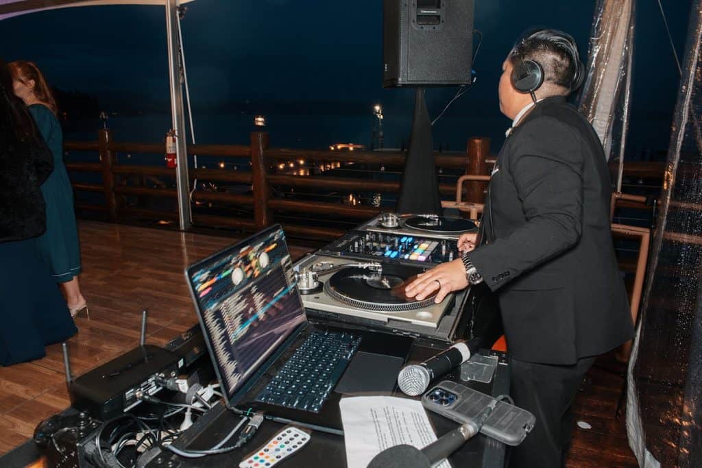 DJ Wrex at booth, night, blue light, David & Marissa wedding at Sunnyside, Lake Tahoe