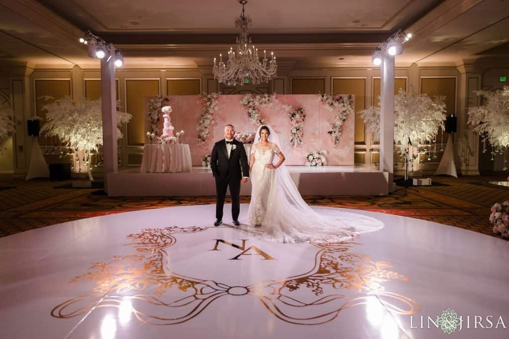 First dance on monogram floor, chandelier ballroom, Nicole & Austin wedding at The Langham Pasadena
