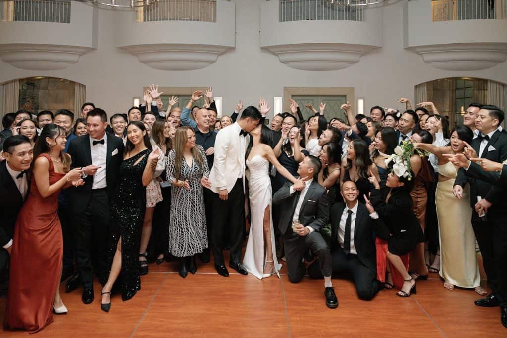 Whole-room group shot, hands up, Lindsay & Sean wedding at The Maybourne Beverly Hills