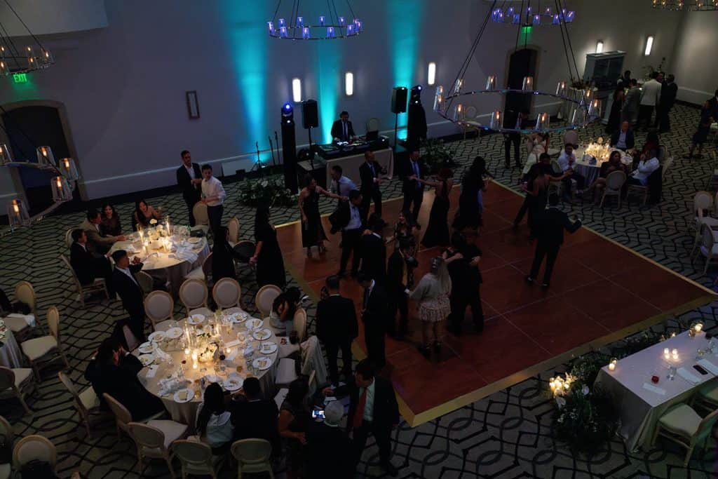 Ballroom with teal uplighting, floor wide, Lindsay & Sean wedding at The Maybourne Beverly Hills