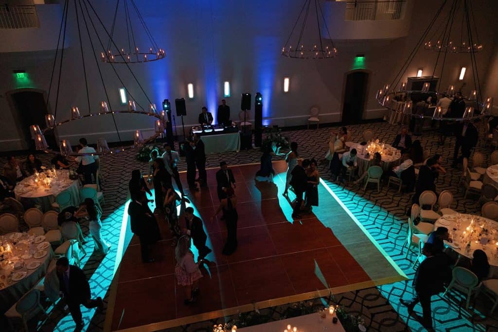 Ballroom teal uplight, dark floor, Lindsay & Sean wedding at The Maybourne Beverly Hills