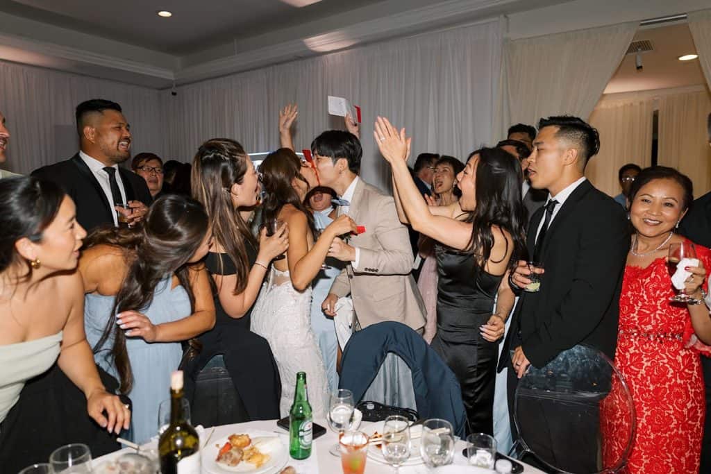 Guests cheering at tables, Sarah & Jeff wedding at Mon Cheri, Garden Grove