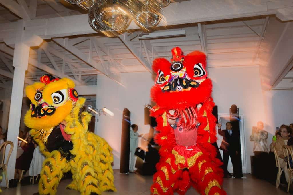 Lion dance in white warehouse, Crystal & Risen wedding at The Revery LA