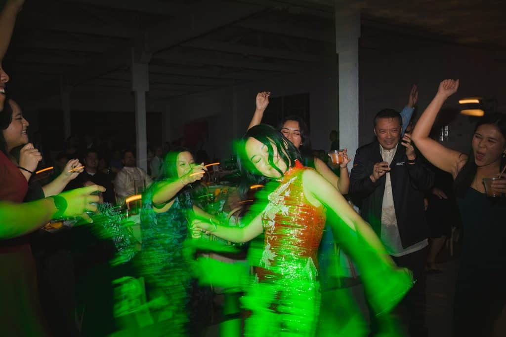 Dancers in green light, motion blur, Crystal & Risen wedding at The Revery LA