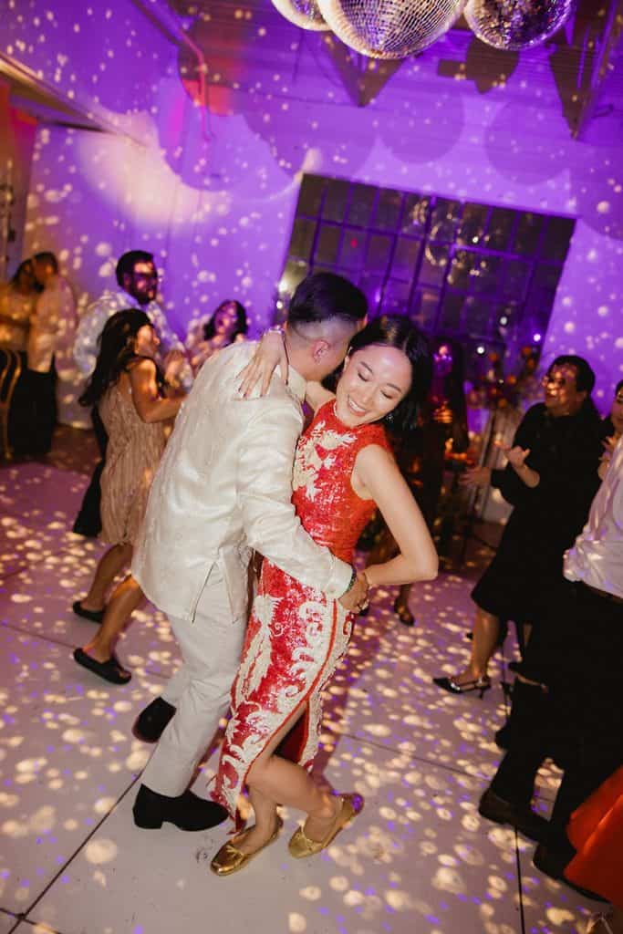 Couple under disco balls, purple wash, Crystal & Risen wedding at The Revery LA