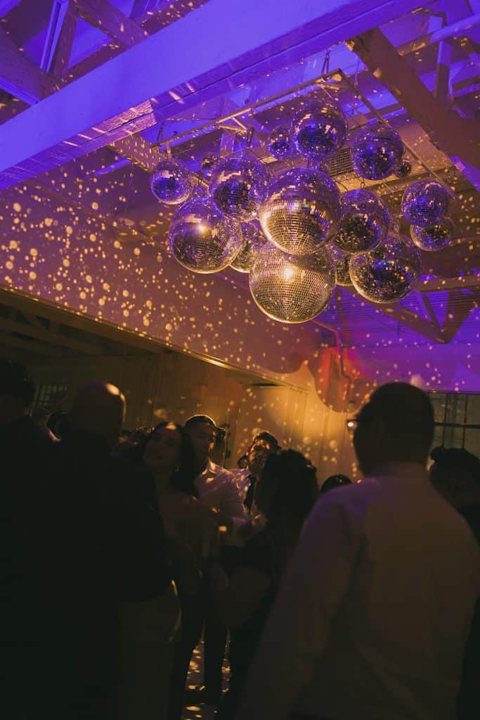 Disco-ball ceiling, purple lighting, Crystal & Risen wedding at The Revery LA
