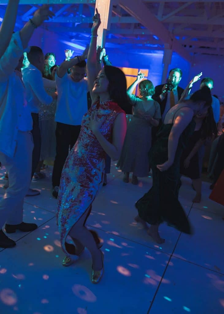 Floor under blue lighting, hands up, Crystal & Risen wedding at The Revery LA