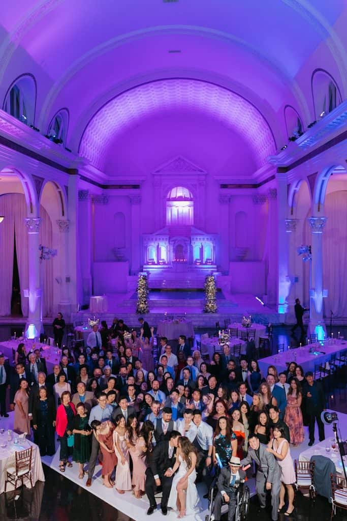 Venue drenched in purple uplighting, Charisse & Fred wedding at Vibiana
