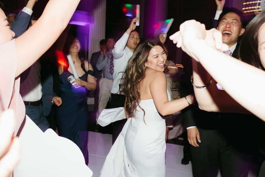 Bride dancing, foam sticks, Charisse & Fred wedding at Vibiana