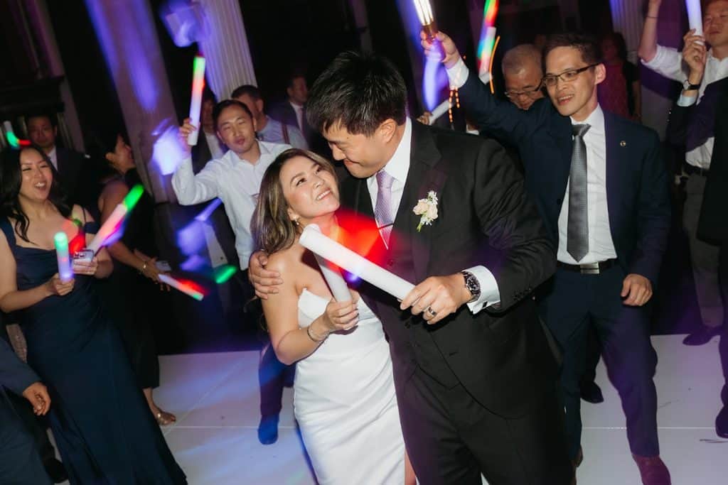 Couple partying with LED sticks, Charisse & Fred wedding at Vibiana
