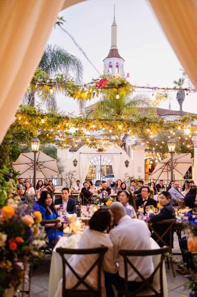 Courtyard reception wide under greenery and lights, Denise & Jonathan wedding at Villa & Vine, Santa Barbara