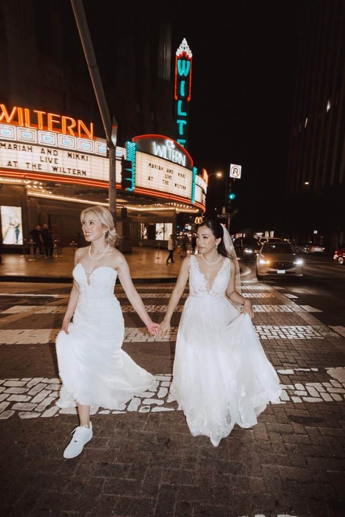 Couple in street, Wiltern marquee glowing, Mariah & Nikki wedding at The Wiltern