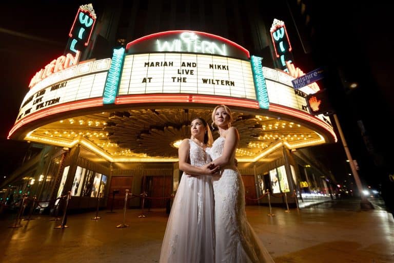 Couple under lit marquee with their names, Mariah & Nikki wedding at The Wiltern